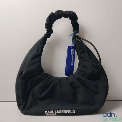 the large black bag has a blue tag attached to it