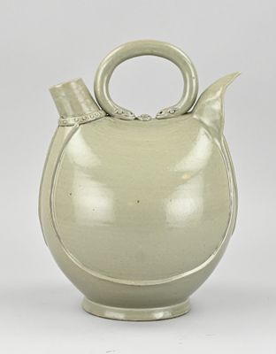 an image of a ceramic teapot with a handle