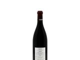 a bottle of wine that is sitting on a table
