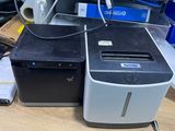 a desktop computer sitting on a desk next to a printer