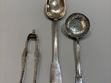 a lot of silver spoons and spoon spoons on the table