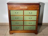 a wooden chest of drawers with many drawers on it