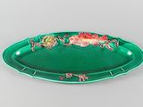 an image of a green tray with flowers and birds on it