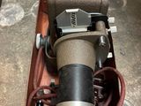 a camera sitting on top of a box on the floor