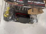a box of tools sitting on the floor next to a box of wires