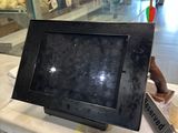 a black picture frame on top of a counter in a store