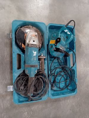 a blue box with tools in it on the floor