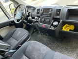 dashboard of a truck with a yellow cloth on the steering wheel
