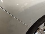 a close up of a car ' s front wheel and tire