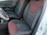 the interior of a car with two seats and a steering wheel