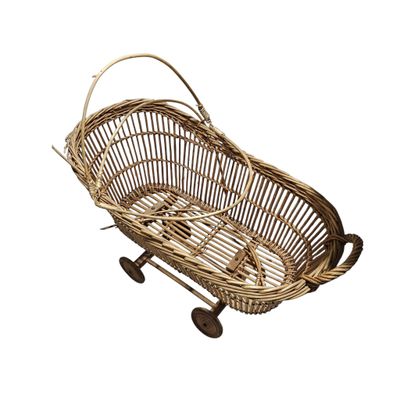 an old fashioned wicker basket with wheels on a white background