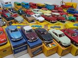 a lot of toy cars that are sitting on a table