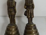 pair of antique brass figurines of a man and a woman