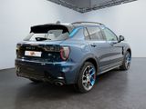 the rear end of a blue bmw suv parked in a showroom