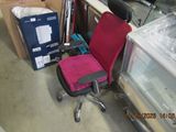 a chair that is sitting in a room next to other items