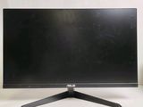 un écran d'ordinateur noir posé sur une table blanche