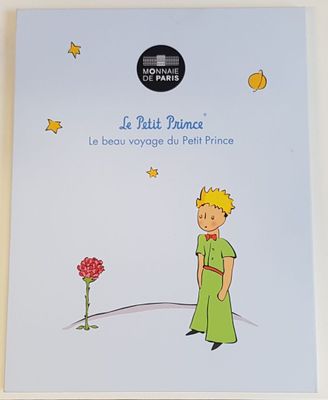a book with a picture of a little boy standing in front of a flower