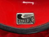 a badge on the back of a red car