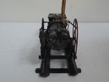 a small model of a steam engine on a stand