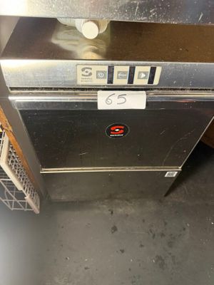 a silver oven that is sitting in a room