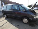 a black van with a broken hood sitting in a parking lot