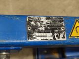 a close up of a sign on a blue machine