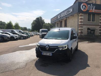 a white van that is parked in front of a building