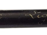 an image of a close up of a baseball bat with writing on it