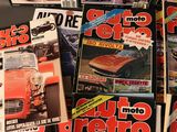 several magazine covers of different cars are stacked on top of each other