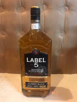 the bottle of labell 5 is sitting on a table