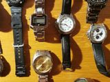 a lot of watches that are sitting on a table