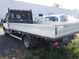 a white truck parked in front of a building