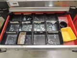 a drawer full of assorted nuts and bolts