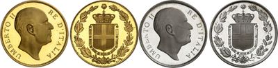 a group of four different colored coins with a crown on them
