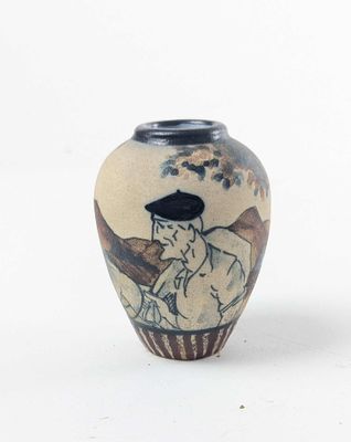 a small vase with a painting on it sitting on a table