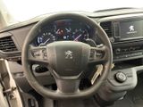 the interior of a car with a steering wheel and dashboard controls