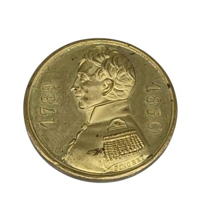 l'image d'une pièce d'or sur laquelle figure le visage d'une femme