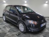 a picture of a black car parked on a checkered floor