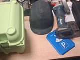 a cluttered desk with a lot of electronics on it