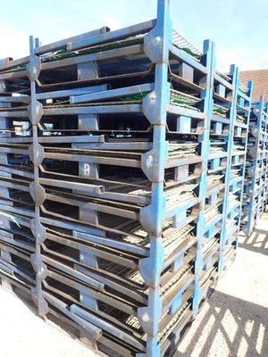 pallets stacked on top of each other in a parking lot