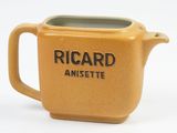 a yellow mug that has a black inscription on it