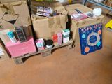 many boxes that are sitting on a pallet in a room