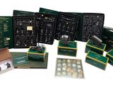 many different types of gold coins in a box