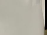 a close up of a white container with a toothbrush in it