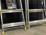 two ladders that are standing next to each other