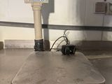 an image of a scale on a floor in a warehouse