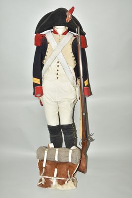 an image of a toy soldier with a rifle and a bag
