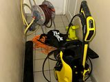 a yellow and black power washer sitting in the corner of a room
