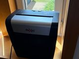 an image of a small window with a paper shredder in it