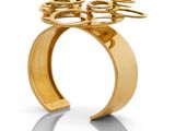 an image of a gold ring with a flower on top of it